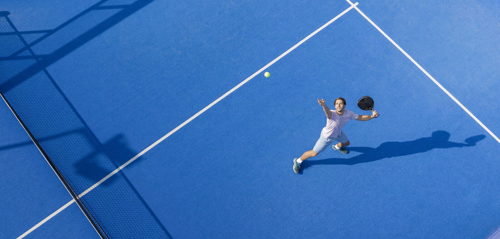 padel campaing image cropped and flipped - Ball on green turf field - Act Sports, the Premium Artificial Sports Turf Supplier
